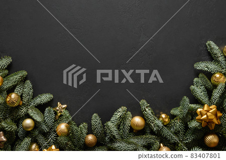 Christmas arch with evergreen nobilis, golden balls on black background. Xmas greeting card. Christmas arch with evergreen nobilis, golden balls on black background. Xmas greeting card. 83407801