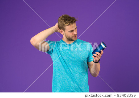 Man on confident face touching his hair, violet background. Man on confident face touching his hair, violet background. 83408359