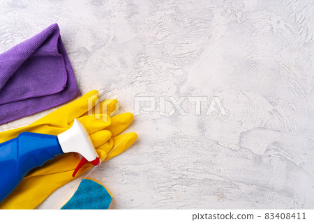 Home cleaning supplies on white wooden background, top view 83408411