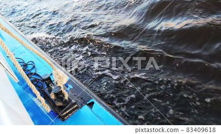 Boat makes the water into beautiful foam wakes. Media. Dark water. First person view. Boat makes the water into beautiful foam wakes. Media. Dark water. First person view. 83409618