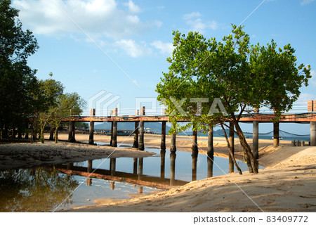 Concrete bridge used as a footpath and transportation on the beach on Koh Phayam in Southern of Thailand. 83409772