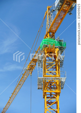 PERAK, MALAYSIA -FEBRUARY 02, 2016: Tower Crane used to lifting heavy load at construction site in Perak, Malaysia    83409925