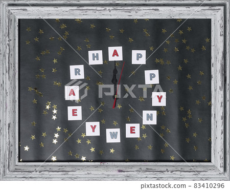 New year greeting card. An impromptu clock in a wooden frame. Waiting for the holiday. New Year flatlay composition New year greeting card. An impromptu clock in a wooden frame. Waiting for the holiday. New Year flatlay composition 83410296
