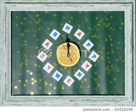 Congratulatory composition with an impromptu clock and Happy New Year greetings instead of numbers. Festive postcard. Flatlay image Congratulatory composition with an impromptu clock and Happy New Year greetings instead of numbers. Festive postcard. Flatlay image 83410299