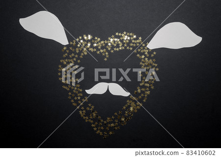 A cheerful romantic picture with a heart with ears and a mustache. Valentine's Day card. Flatlay composition 83410602