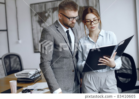 Man and woman read a business contract Man and woman read a business contract 83410605