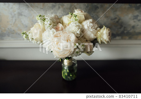 beautiful modern wedding bouquet on black table 83410711