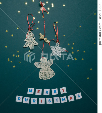 Christmas card with handmade angel herringbone and an asterisk. Craft flatlay composition. Holiday greetings Christmas card with handmade angel herringbone and an asterisk. Craft flatlay composition. Holiday greetings 83411008