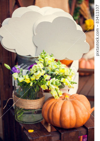 decor for an autumn photo shoot: pumpkin, flowers, speech bubble. decor for an autumn photo shoot: pumpkin, flowers, speech bubble. 83411337