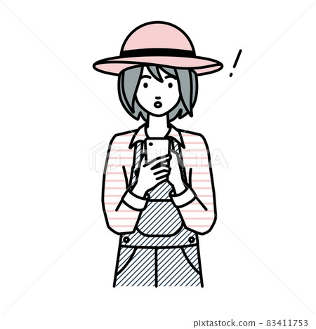 一位農婦在站立和操作智能手機時驚訝地發現了什麼 83411753