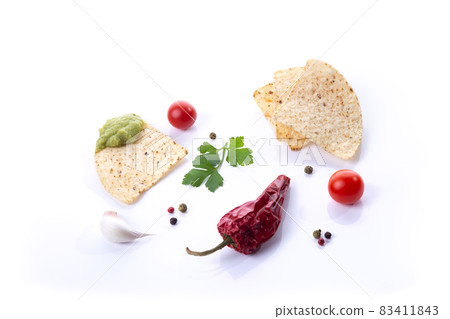 Composition with nachos with guacamole and ingredients isolated on white background. Composition with nachos with guacamole and ingredients isolated on white background. 83411843