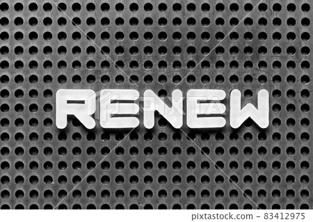 White alphabet letter in word renew on black pegboard background 83412975
