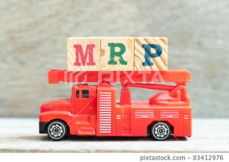 Fire ladder truck hold letter block in word MRP (Abbreviation of Material requirements planning) on wood background 83412976