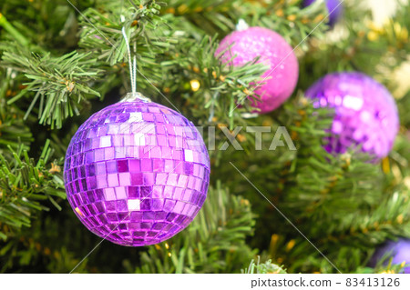 Christmas balls decorate Christmas tree with balls and garland lights with copy space. Preparation to the New Year. Christmas balls decorate Christmas tree with balls and garland lights with copy space. Preparation to the New Year. 83413126