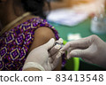 Close-up of doctors, nurses, vaccinating against and treating from coronavirus, covid-19, flu, infection. Medical concept of vaccination. 83413548