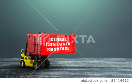 Global container shortage and a forklift. Problems of the international freight transport system. Imbalance, high prices for the transportation of goods. Consequences of economic slowdown. Global container shortage and a forklift. Problems of the international freight transport system. Imbalance, high prices for the transportation of goods. Consequences of economic slowdown. 83414412