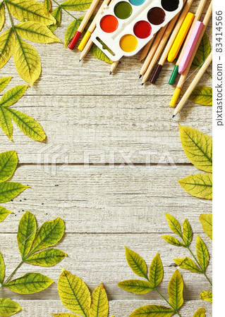 Back to school concept. Flatlay background. Table with autumn leaves and different school supplies, stationery, pencils. Free space for your text. Back to school concept. Flatlay background. Table with autumn leaves and different school supplies, stationery, pencils. Free space for your text. 83414566