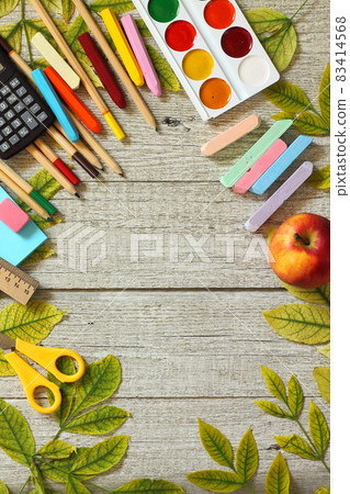 Back to school concept. Flatlay background. Table with autumn leaves and different school supplies, stationery, pencils. Free space for your text. Back to school concept. Flatlay background. Table with autumn leaves and different school supplies, stationery, pencils. Free space for your text. 83414568