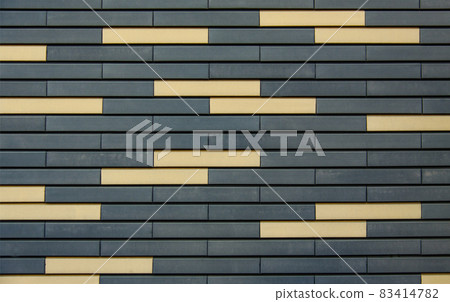 Textured oblong ceramic tiles in warm colors. Textured oblong ceramic tiles in warm colors. 83414782