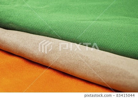 Colorful and bright fabric samples for furniture and upholstery. Close-up of a palette of textile abstract stripes of different colors 83415044