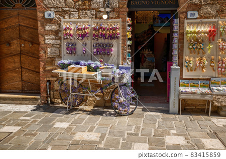 Bagno Vignoni, Tuscany, Italy. August 2020. A souvenir shop for tourists. Beautiful summer day. 83415859