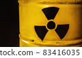 Yellow metal barrel with radioactive decay symbol 83416035