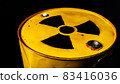 Yellow metal barrel with radioactive decay symbol 83416036
