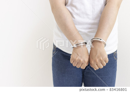 A woman wearing handcuffs (30s, Japanese, no face). Image of arrest 83416801