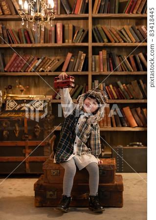 Girl playing with toys Vintage hat pilot Girl playing with toys Vintage hat pilot 83418445