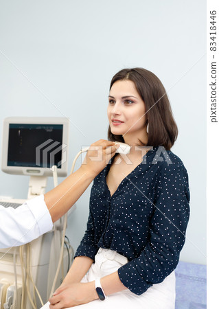 Routine medical ultrasound examination for cancer in the clinic, vertical Routine medical ultrasound examination for cancer in the clinic, vertical 83418446