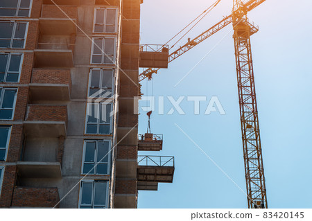 construction of new modern skyscraper or living building in big city construction of new modern skyscraper or living building in big city 83420145