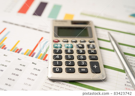 Calculator on graph paper. Finance development, Banking Account, Statistics, Investment Analytic research data economy, Stock exchange trading, Business company concept. Calculator on graph paper. Finance development, Banking Account, Statistics, Investment Analytic research data economy, Stock exchange trading, Business company concept. 83423742