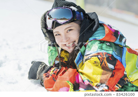 A woman snowboarding A woman snowboarding 83426100