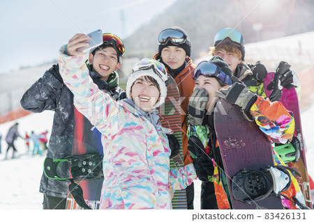 College students playing at the ski resort 83426131