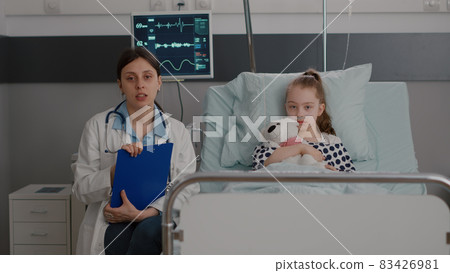 Pov pediatrician woman doctor explaining health recovery treatment to remote family 83426981