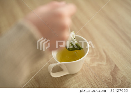 Tea time with tea bag 83427663