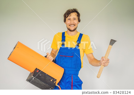 Male foreman for installing stretch ceilings with air heater Male foreman for installing stretch ceilings with air heater 83428124