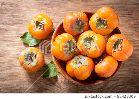 fresh ripe persimmon fruit, top view fresh ripe persimmon fruit, top view 83428309