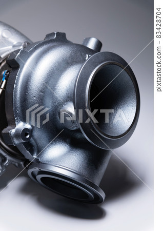 New turbocharged engine on a gray background. Impeller parts New turbocharged engine on a gray background. Impeller parts 83428704