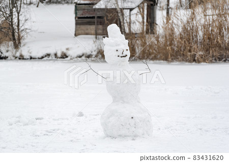 Snowman on winter park background. Winter holidays. Snowy landscape. Winter time. 83431620