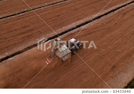 Peat Harvester Tractor on Collecting Extracting Peat. Peat Harvester Tractor on Collecting Extracting Peat. 83433840