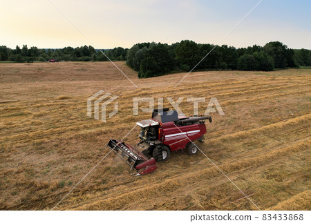 Combine harvester working in wheat field. Combine harvester working in wheat field. 83433868