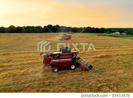 Combine harvester working in wheat field. Combine harvester working in wheat field. 83433870