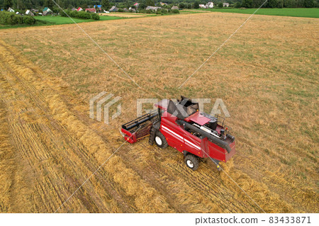 Combine harvester working in wheat field. Combine harvester working in wheat field. 83433871