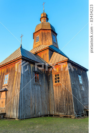 Wooden 18th century church of St. Nicholas in authentic Cossack farm in Stetsivka village in Cherkasy region, Ukraine 83434223