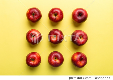 Many red apples on colored background, top view. Autumn pattern with fresh apple above view 83435533