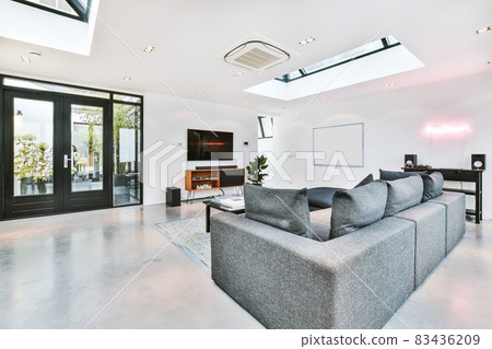 Elegant living room with a large TV and sofa 83436209