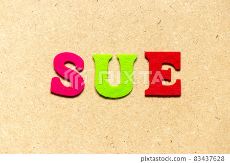 Color cloth alphabet letter in word sue on wood background 83437628