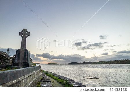 The sun is setting above the Abbey Graveyard which was build by Hugh O Donnell in 1474 - all names and artwork removed 83438188
