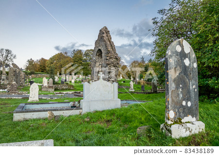 The sun is setting above the Abbey Graveyard which was build by Hugh O Donnell in 1474 - all names and artwork removed 83438189